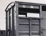 Black and white photograph of vacuum-fitted cattle wagon No. 2242. Copyright L and GRP